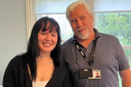 Millie smiling next to her old project worker. She is nominated for young campaigner of the year at the youth matters awards 